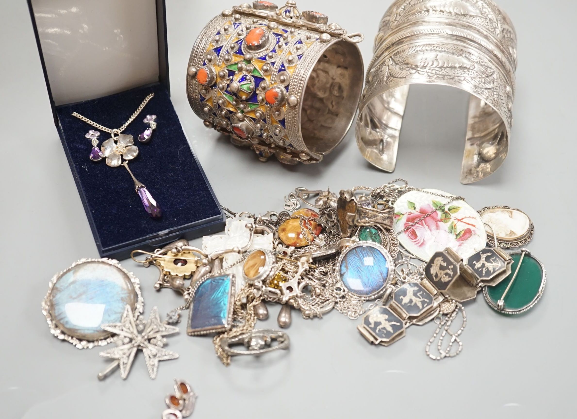 A 1950's box and a quantity of assorted costume jewellery, including continental bangles, etc.